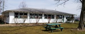 A white building in the park.
